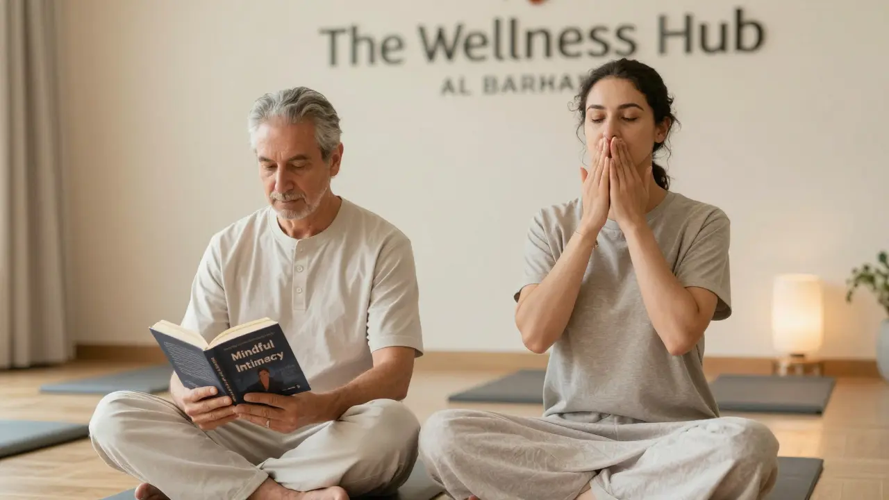 A couple in a calm wellness workshop practicing mindful breathwork, holding a book on intimate connection.